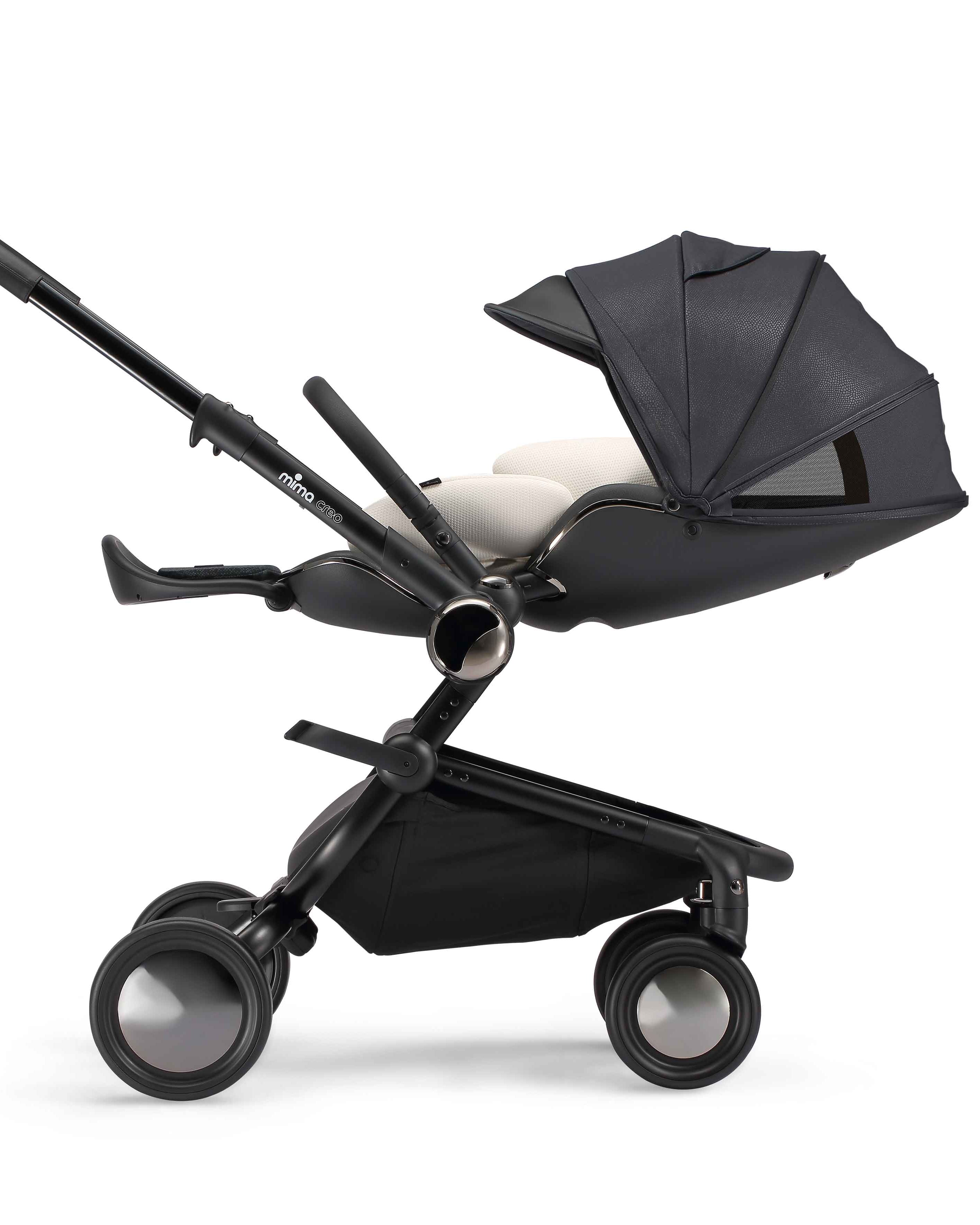 mima newborn snuggle on a creo black stroller.