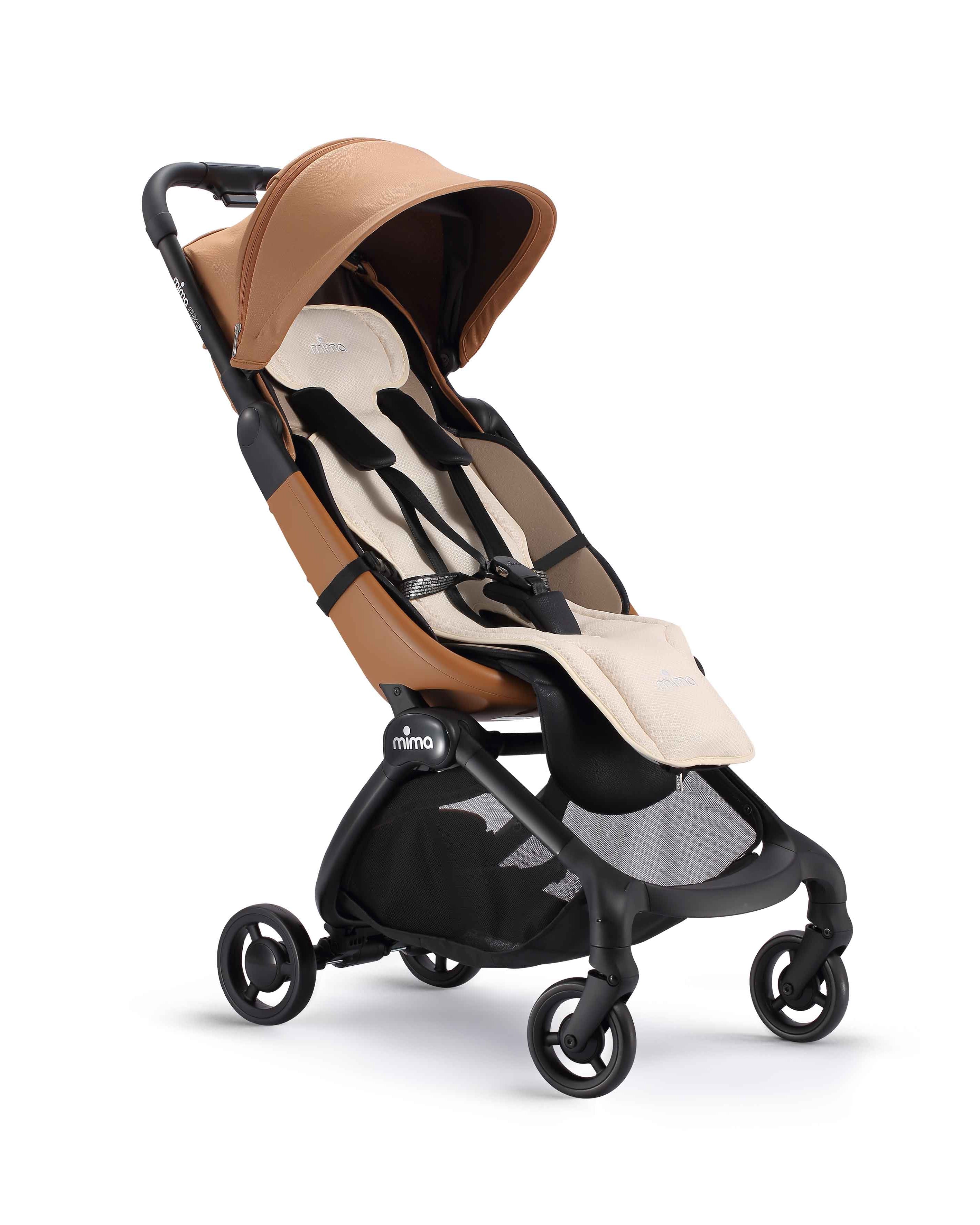 flo donut seat pad in beige installed on a miro stroller, angle