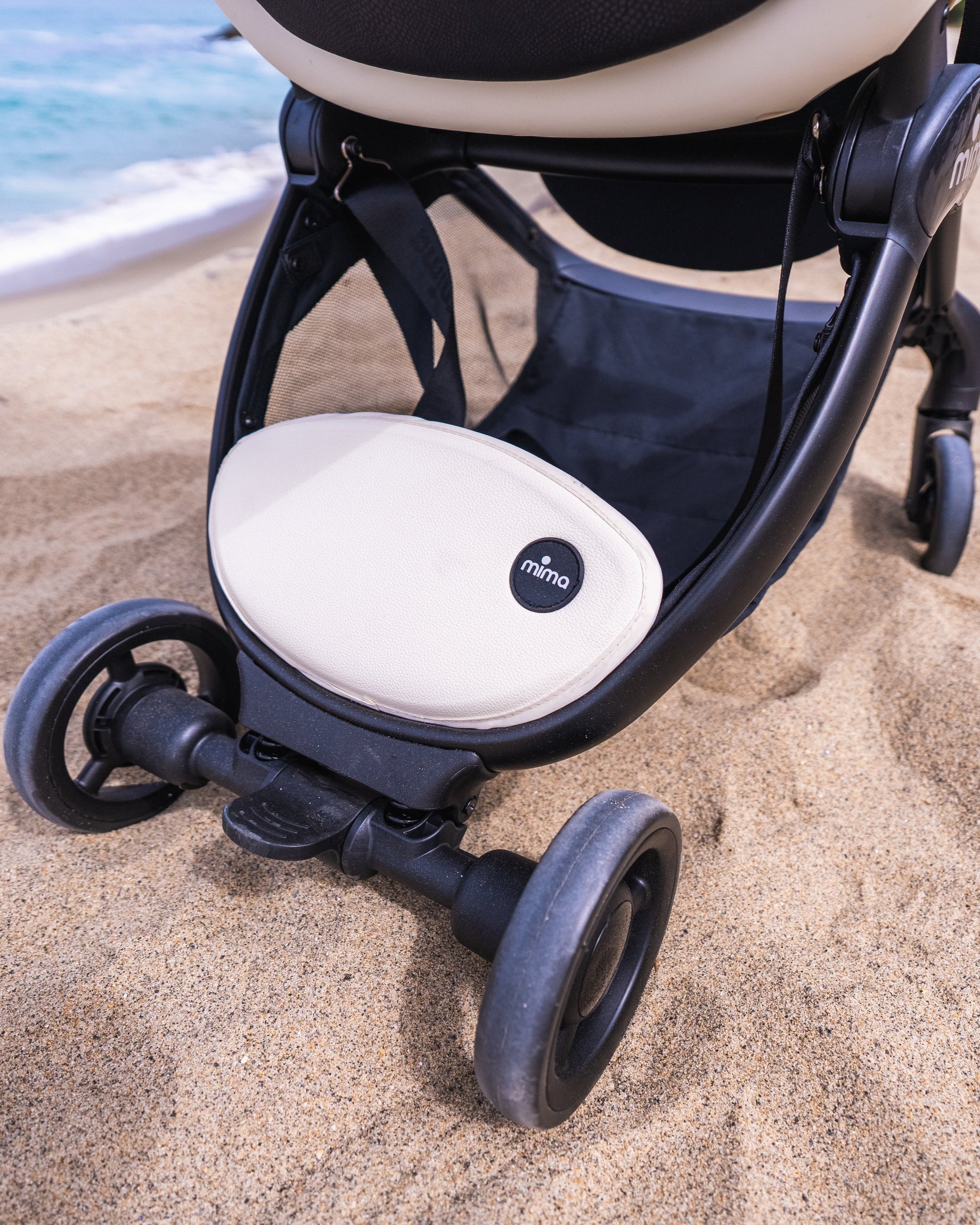 close up of basket cover on mima miro stroller in white.