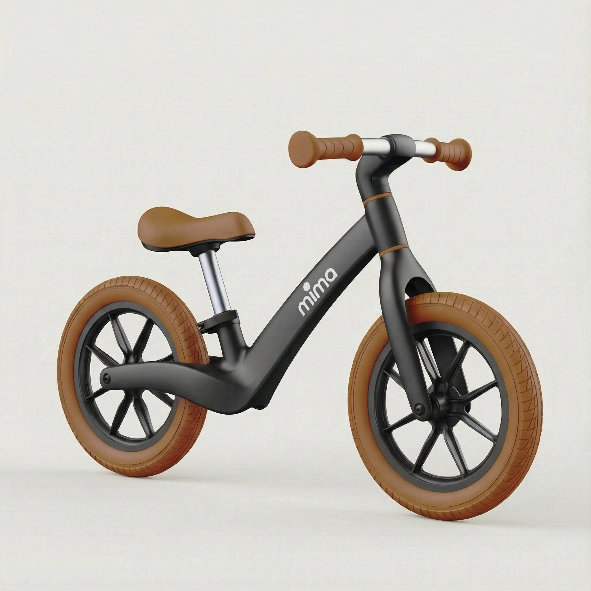 Angled view of mima zoom lite balance bike in black