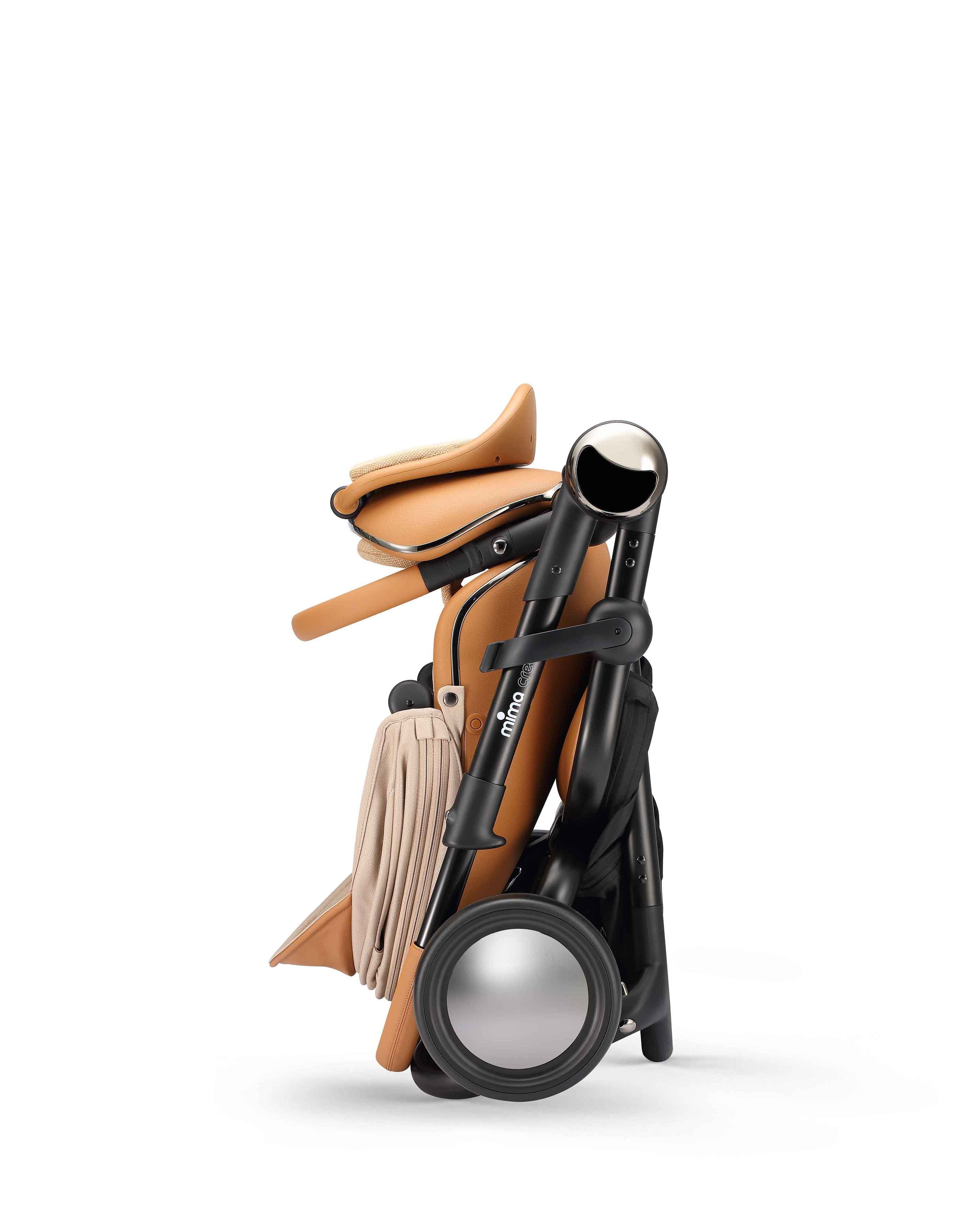 mima creo stroller in mocha in folded position, side view