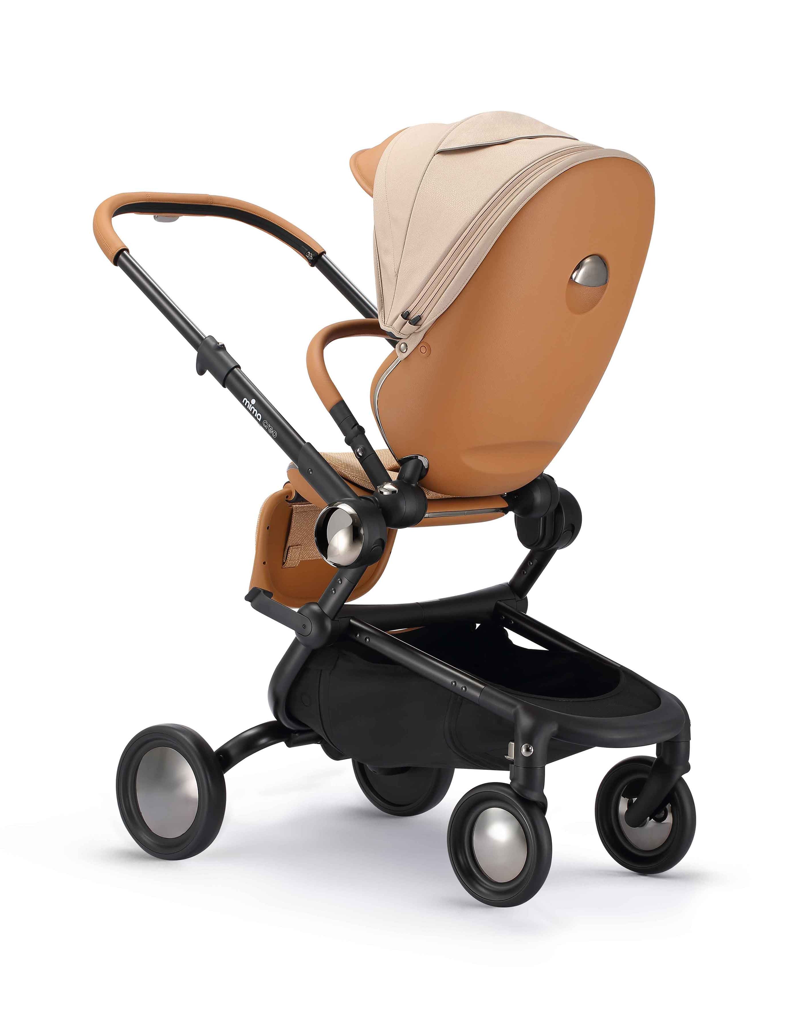 rear angled view of parent facing mima creo stroller in mocha