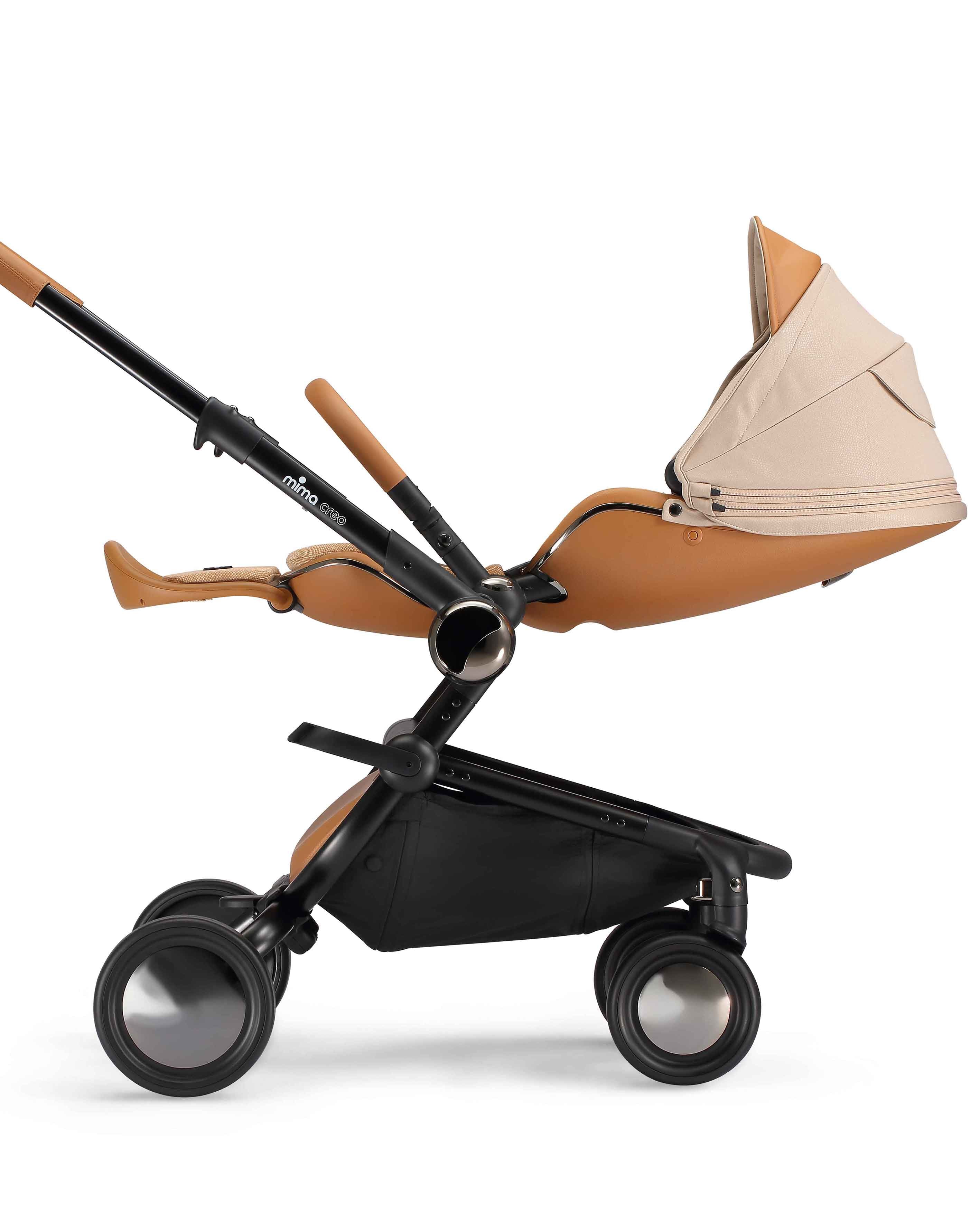 side view of parent facing fully reclined mima creo compact stroller in mocha