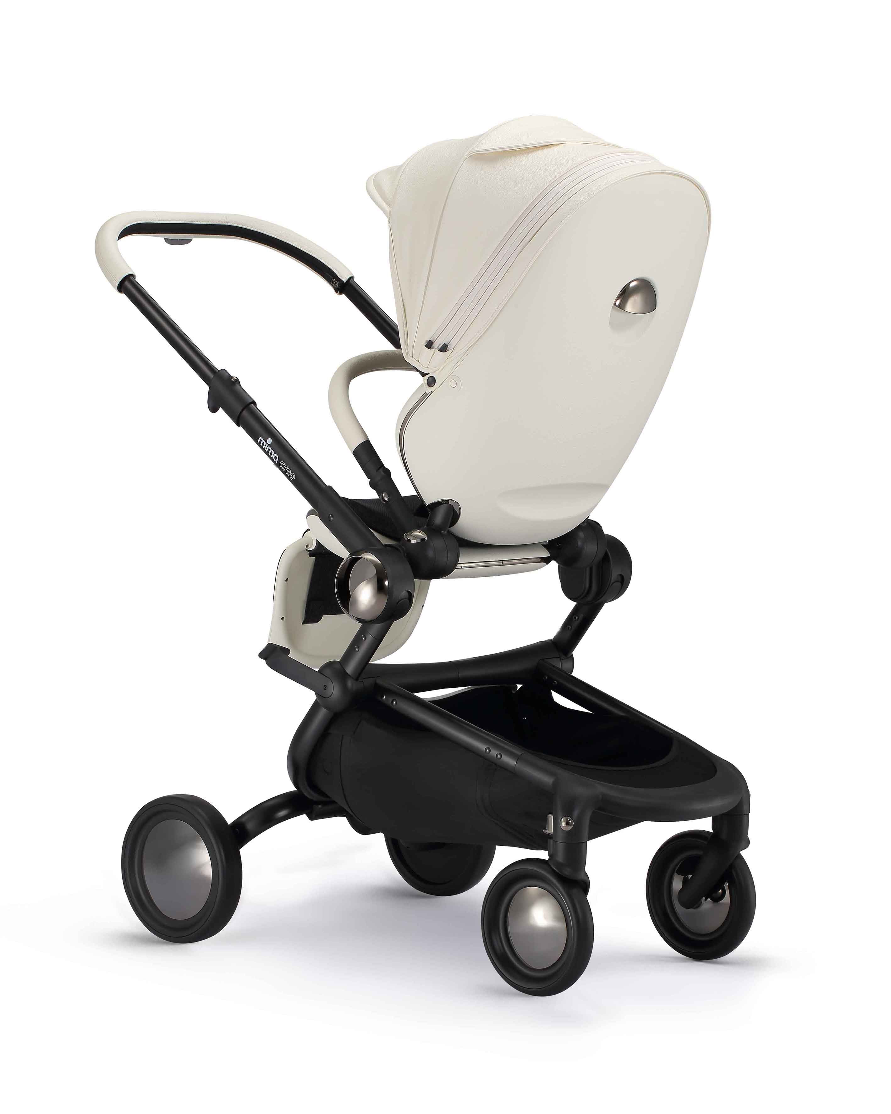 rear angled view of parent facing mima creo stroller in white